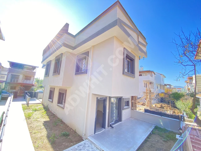 New 1+2 villa with a garden very close to the sea for sale in Doğanbey