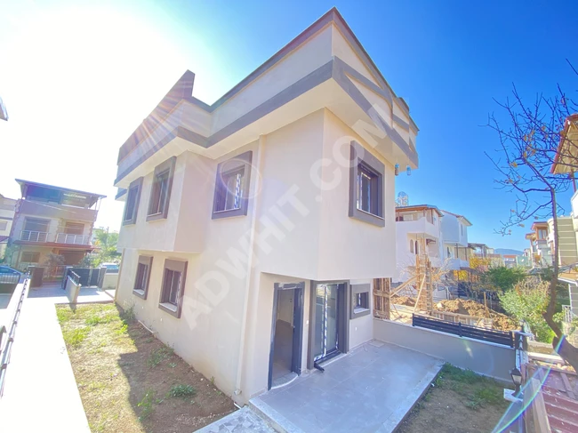 New 1+2 villa with a garden very close to the sea for sale in Doğanbey