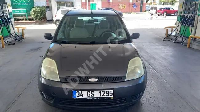 FORD FIESTA car 1.4 model 2006 diesel with air conditioning, dual display, and tape player.