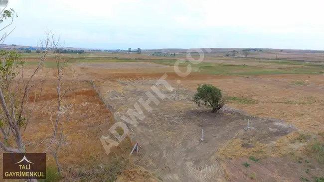 A plot of land measuring 1,112 square meters for sale in DEĞİRMENKÖY, near residential areas and with individual ownership.