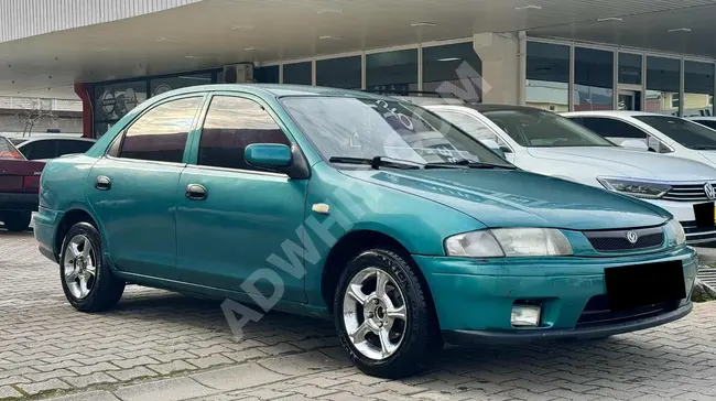 Mazda 323 بدون اي مشاكل