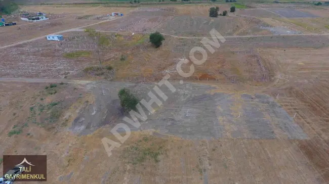 A plot of land measuring 1,112 square meters for sale in DEĞİRMENKÖY, near residential areas and with individual ownership.