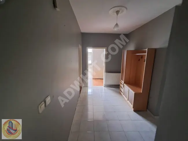 2+1 apartment with an open kitchen in a central location in TUZLA AYDINLI