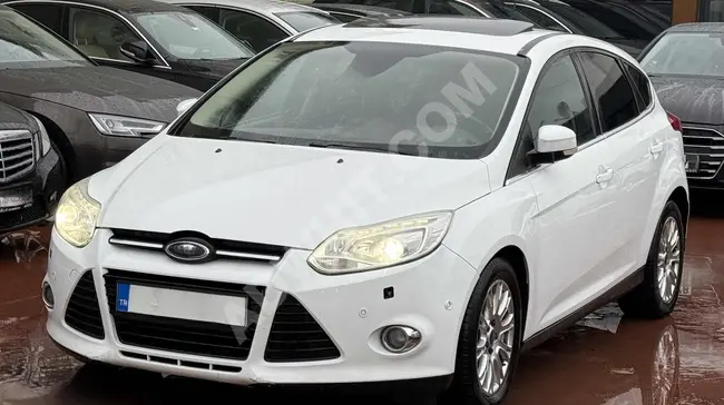 Ford Focus TITANIUM Diesel with 115 horsepower, sunroof, heated seats, and a loan with an interest rate of 1.99%.