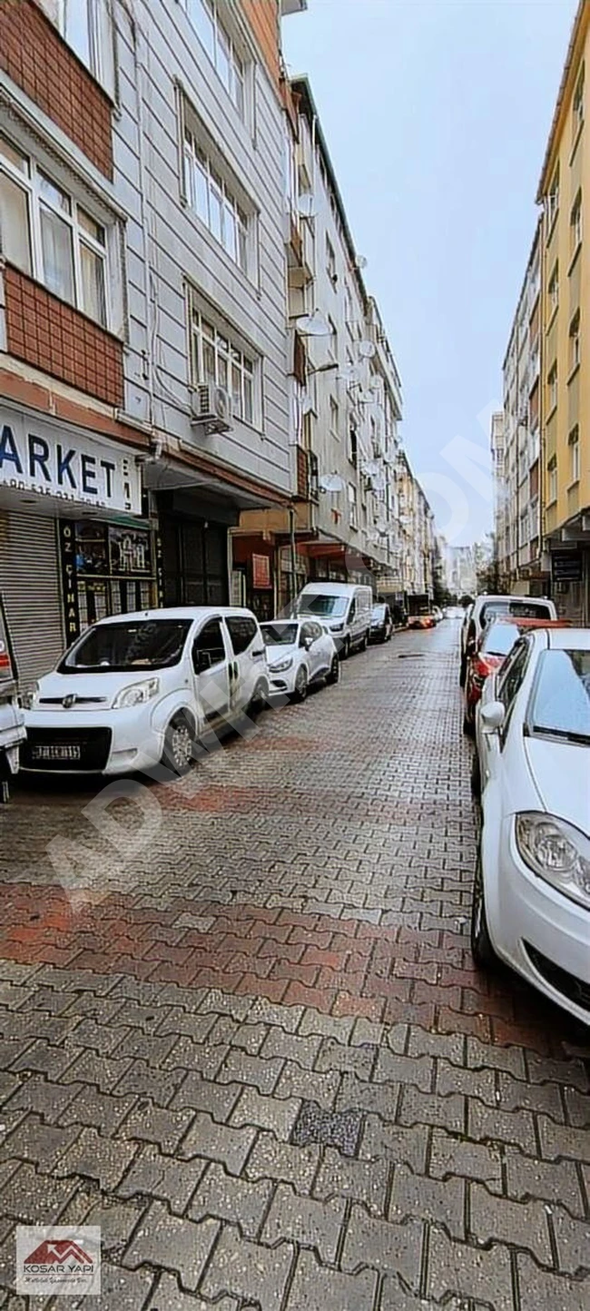 A two-story store on Haznedar Posta Street with automatic sliding doors and windows.