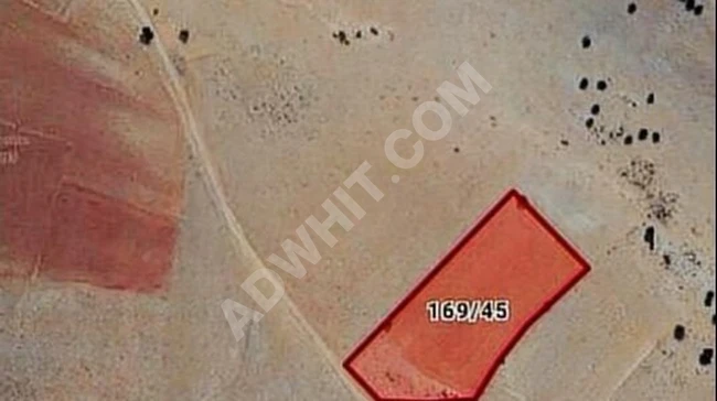 Agricultural land at an attractive price, with an area of 6,695 square meters overlooking the road, for sale.