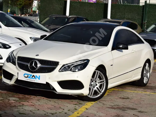 MERCEDES E250 CGI COUPE car, 2011 model, with a 2016 appearance.