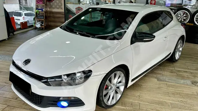 Financing opportunity for a 2010 model VW Scirocco with manual transmission and 160 horsepower. Installment available with a 2.71% monthly card rate.