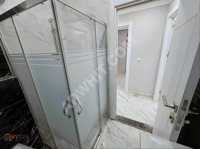 A new apartment with an area of 95 square meters 2+1 for sale, no transfer of ownership cost, middle floor in İSTASYON