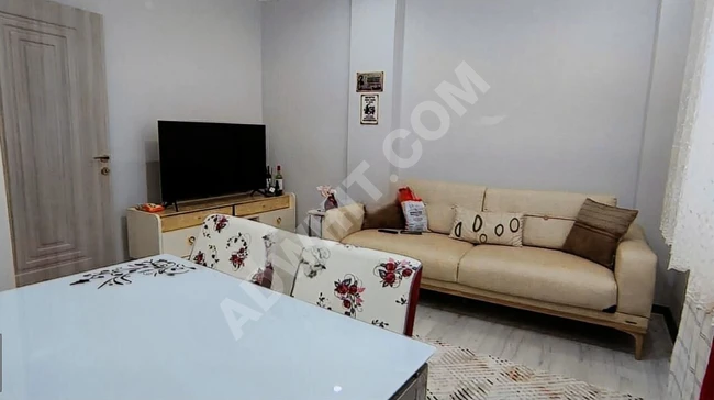 1+1 apartment with an elevator on the middle floor, suitable for obtaining a loan from BİNEVLER GAYRİMENKUL.