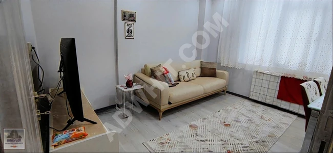 1+1 apartment with an elevator on the middle floor, suitable for obtaining a loan from BİNEVLER GAYRİMENKUL.