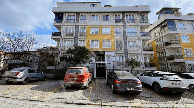 An apartment with 2+1 capacity and a balcony for sale close to the school, front-facing.