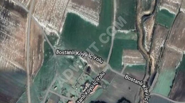 Agricultural land for sale with an area of 11,786 square meters on the main road in Bostanlı - Havsa.