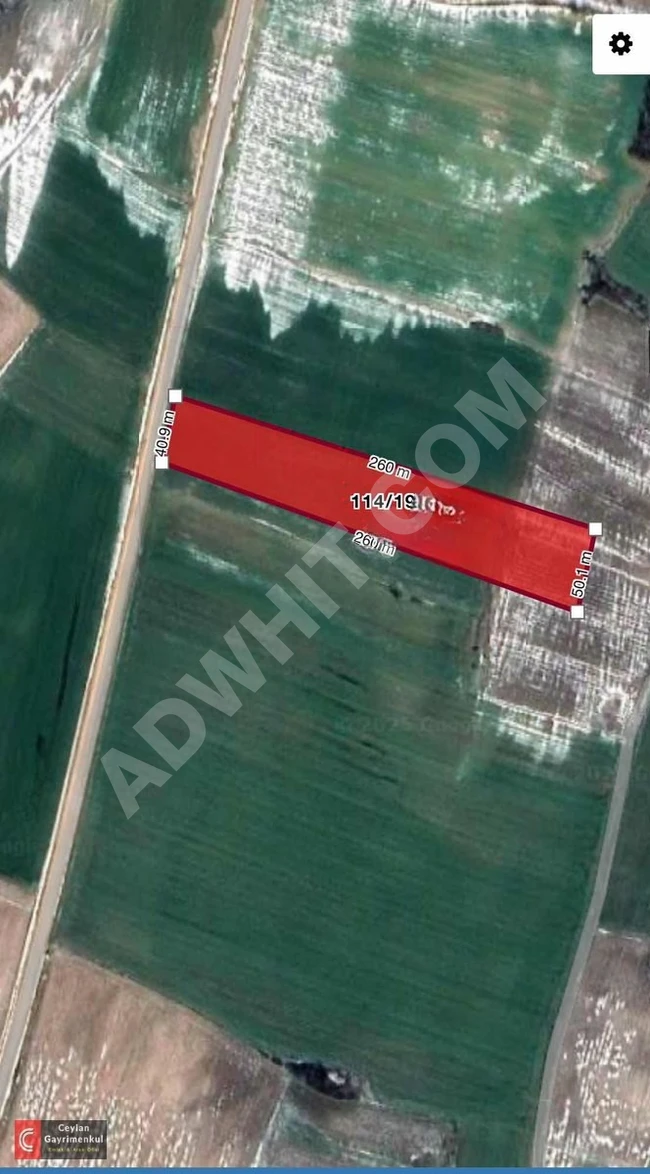 Agricultural land for sale with an area of 11,786 square meters on the main road in Bostanlı - Havsa.