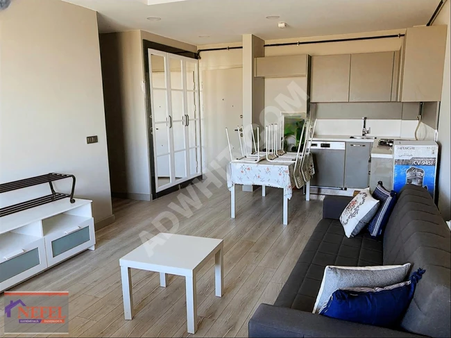 1+1 apartment with a balcony overlooking a beautiful view in the ARDIÇLI Square