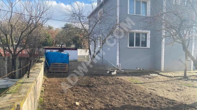 An independent two-story house with two apartments and a garden from EVwest in Ahmetbey.