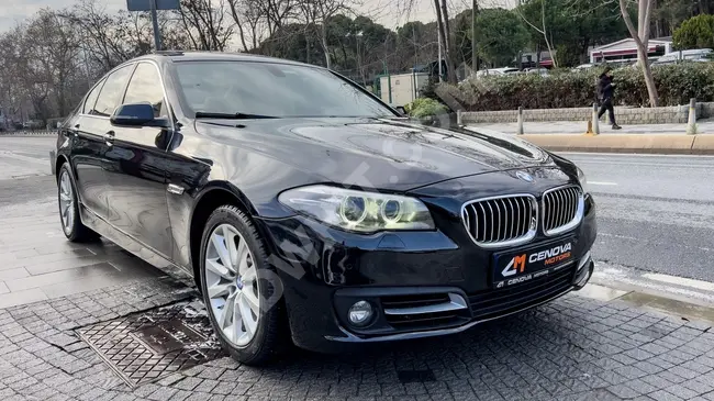 BMW 520i model 2016 with suction doors, digital display screen, navigation system, electric trunk door, and beige interior.