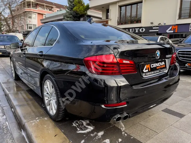 BMW 520i model 2016 with suction doors, digital display screen, navigation system, electric trunk door, and beige interior.