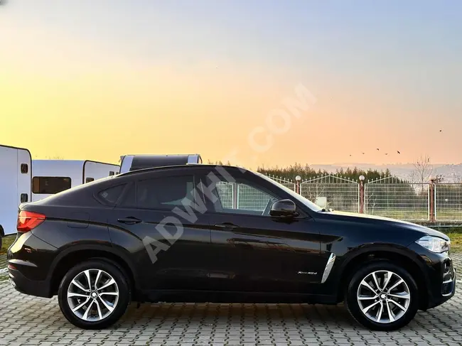 BMW X6 40d بدون عيوب ، بدون طلاء +  نظام ملاحة + حقيبة أمتعة  إلكترونية + شاشة NBT من ZERAY