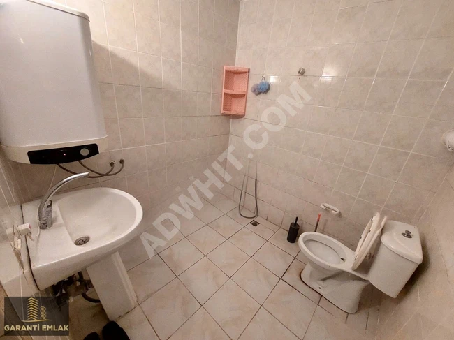 Furnished 2 + 1 apartment with an open kitchen in Kemalpaşa