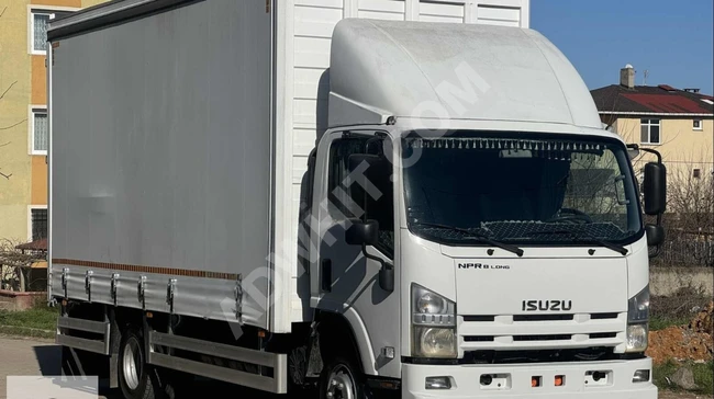 ISUZU NPR 8 LONG خروج 2012 بدون عيوب 175 ألف بصندوق جديد