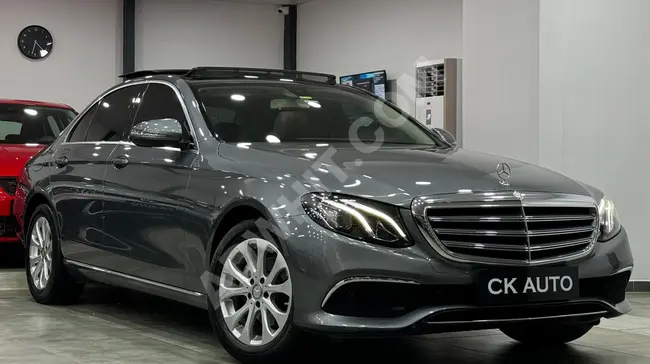 MERCEDES E180 EXCLUSIVE 9G model 2017 in good condition, 91000 km, with a panoramic sunroof.