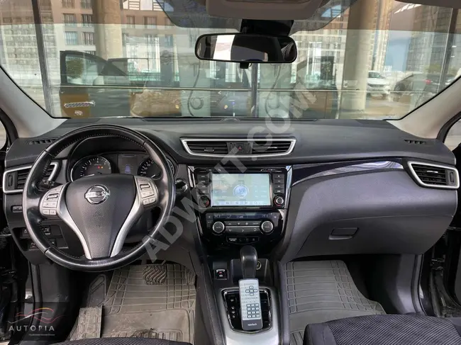 Nissan Qashqai with a glass roof, automatic transmission, and a rear-view camera screen from Adil Auto.