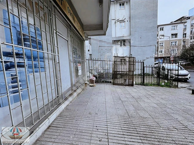 A vacant two-story shop in the center with two separate entrances.