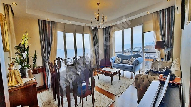 3+1 apartment for sale by ÖNCÜ within a residential complex with a sea view