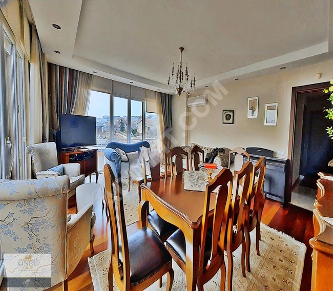 3+1 apartment for sale by ÖNCÜ within a residential complex with a sea view