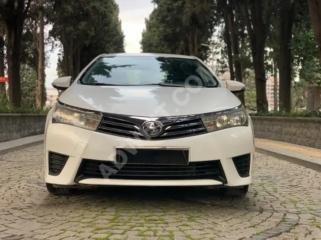 A very clean COROLLA car with a tablet screen, runs for 125,000 km