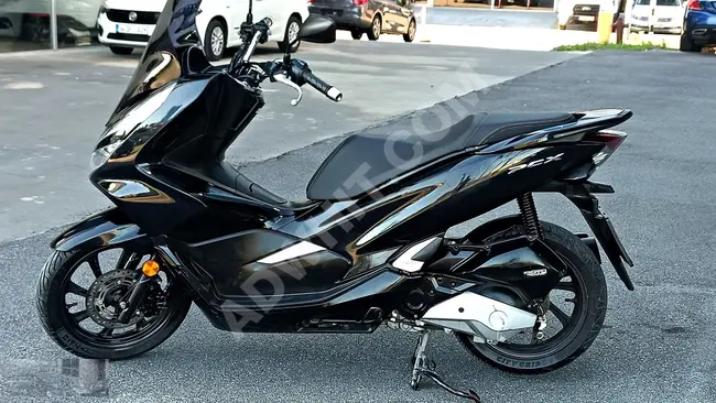 دراجة نارية Honda PCX125 موديل 2018 بلا حوادث لا يوجد سجل مرور القسط ببطاقة الائتمان يمكن مبادلة آيفون