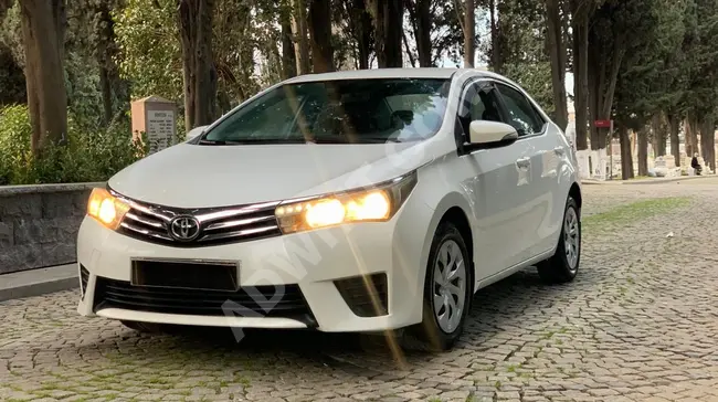 A very clean COROLLA car with a tablet screen, runs for 125,000 km