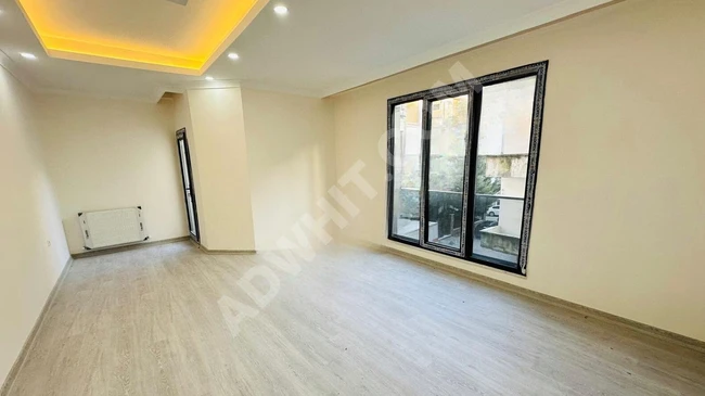 Apartment 2 + 1, 100 square meters, new on a middle floor equipped with an elevator in SEFAKÖY MERKEZ.