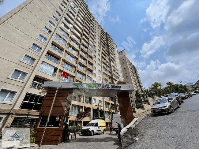 1+1 apartment in the YILDIZ PARK complex with a pool and parking lot.