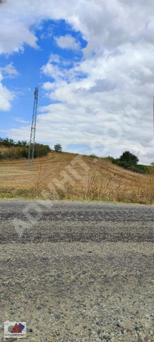 A plot of land for investment on the asphalt road, frontage on the street.