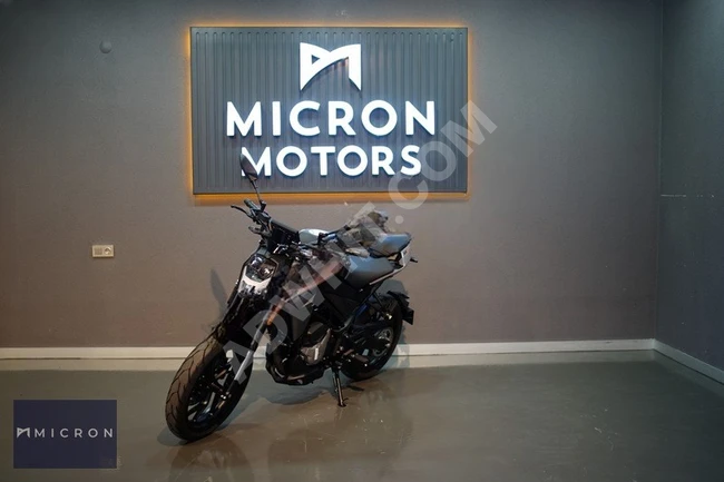 CFMOTO 250NK motorcycle and a 12-month installment offer using a credit card.