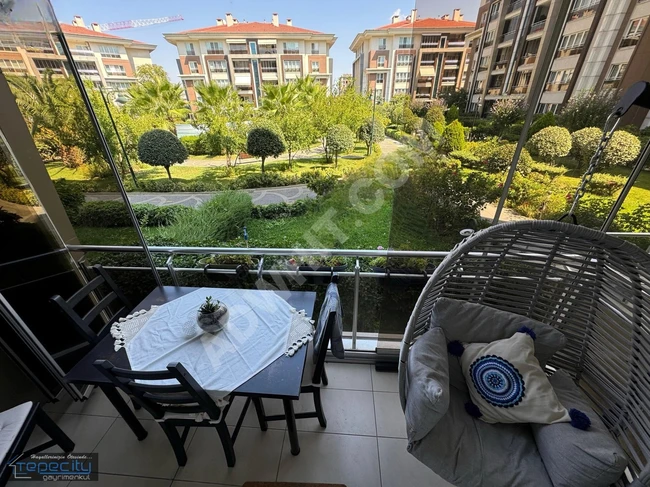 A 3+1 apartment for sale on the ground floor in Eviza Konakları