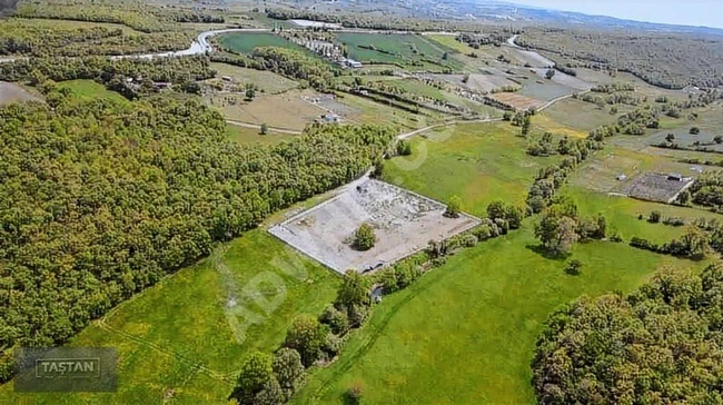 Opportunity land with an area of 9,300 square meters, surrounded by a wall.