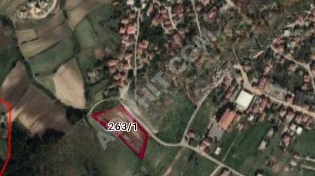 A plot of land with an area of 246 square meters in the center of the village of ÇATALCA ÇİFTLİKKÖY, facing the asphalt road.