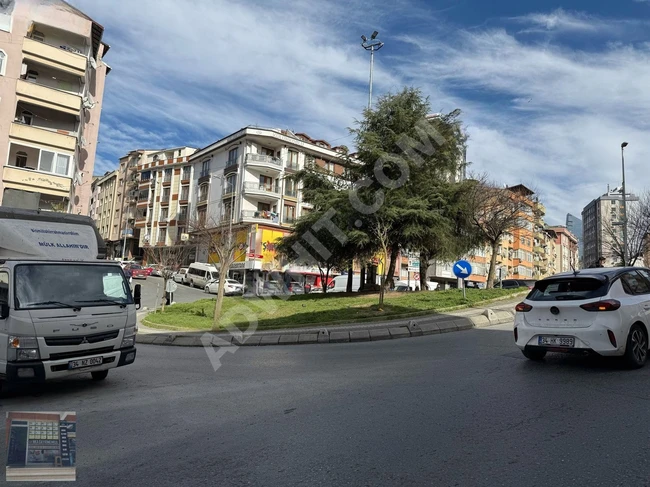 A shop with open facades located on GÜZELDERE Street, containing a bathroom and a kitchen.