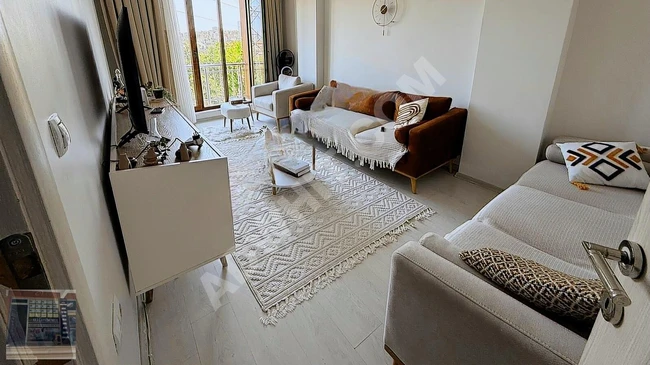 2+1 apartment in a new building with a floor title deed in a central location