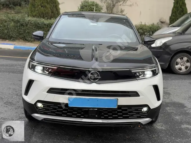 سيارة موديل 2023 MOKKA-E +BOLD بدون خطوط، إمكانية القرض والتبديل بنسبة 1.99.