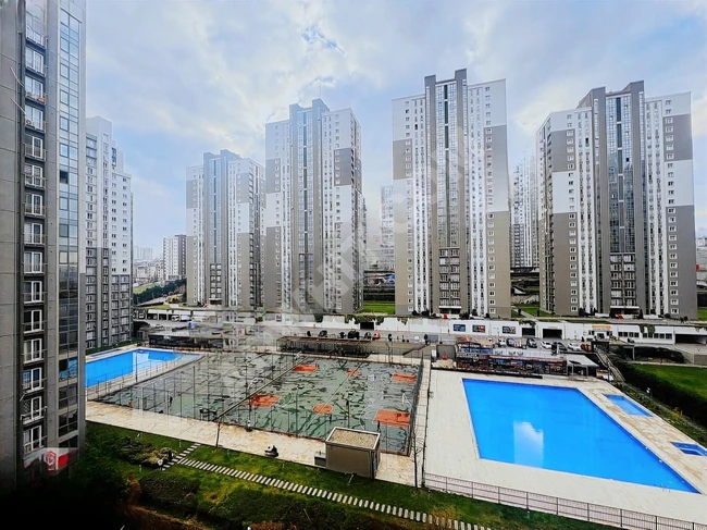 2+1 apartment in the EVİM YÜKSEKDAĞ complex with a balcony overlooking the pool.