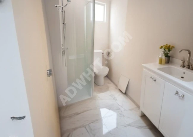 2+1 apartment on the ground floor with a garden, delivered from the project, in a central location in ZUHURATBABA.