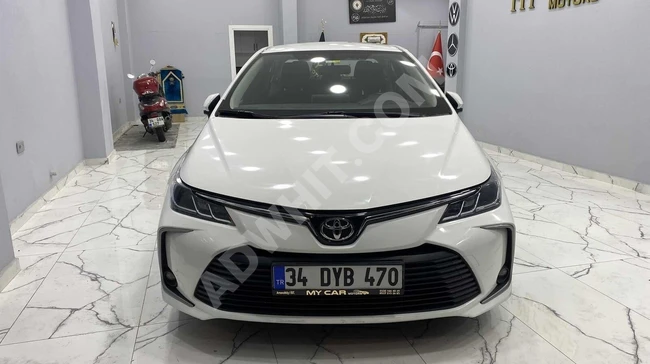 MY CAR MOTORS'TAN COROLLA