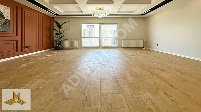 An apartment with architectural design and elegant decor inside a complex by MAVİ IŞIK.