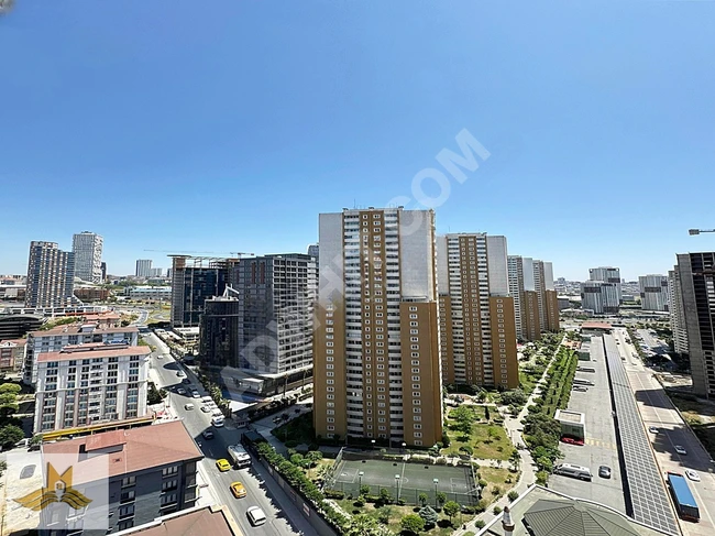 An apartment with architectural design and elegant decor inside a complex by MAVİ IŞIK.