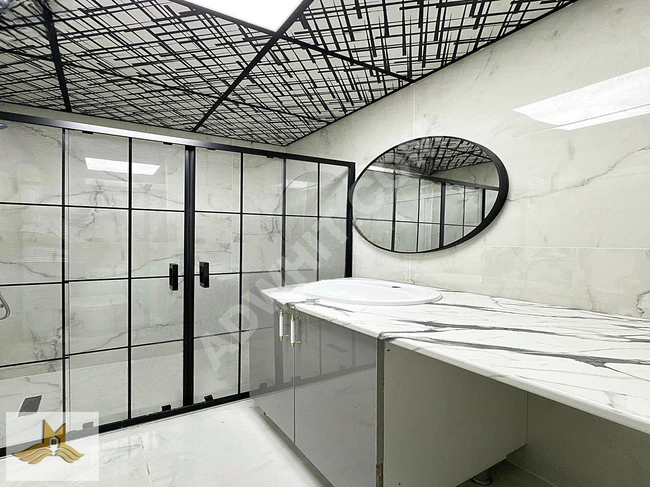An apartment with architectural design and elegant decor inside a complex by MAVİ IŞIK.