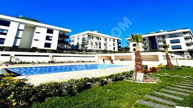 An apartment with a wonderful design and landscaping on-site in BEYLİKDÜZÜ ADNAN KAHVECİ.